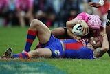Origin doubt ... Darius Boyd is tackled by the Warriors defence