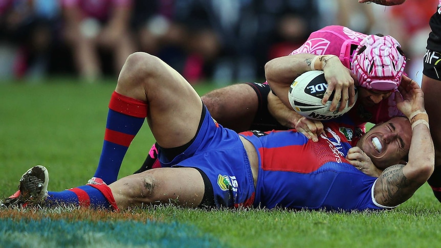 Origin doubt ... Darius Boyd is tackled by the Warriors defence