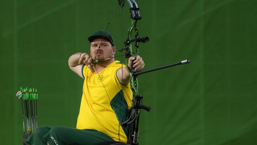 Man competing in Archery 