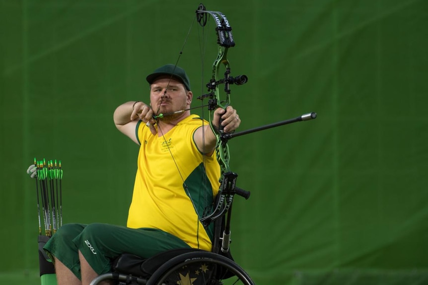 Man competing in Archery 
