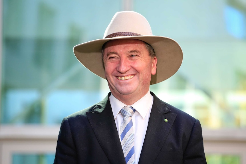 Barnaby Joyce smiles a press conference