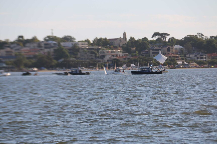 Just the tail of a light plane which crashed into the Swan River in Perth remains visible.