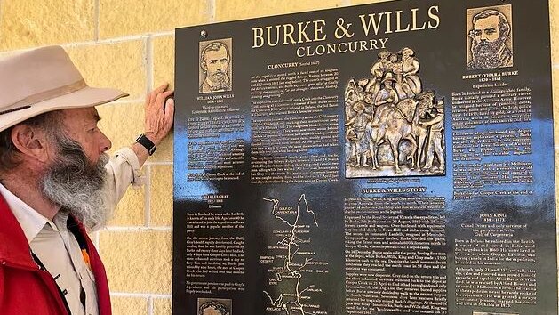 Phil McDonald reads an interpretive panel about the Burke and Wills expedition in Cloncurry.