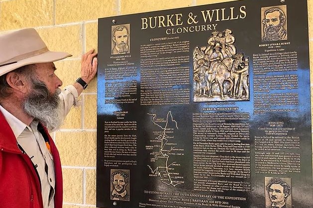 Phil McDonald reads an interpretive panel about the Burke and Wills expedition in Cloncurry.