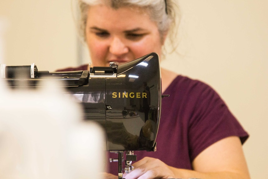 Woman using a sewing machine