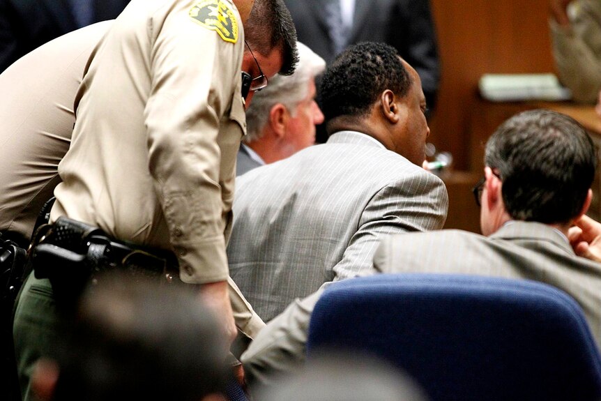 Conrad Murray is handcuffed moments after being found guilty.