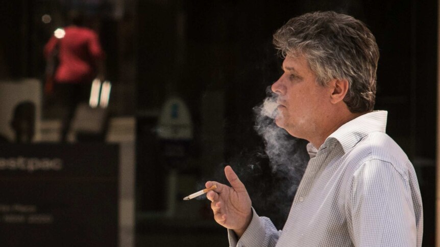 A man smoking in Martin Place.