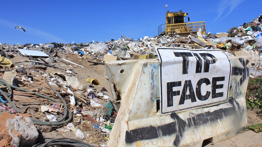 A bulldozer works at the current Esperance rubbish tip site.