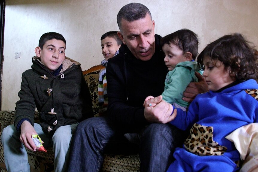 Kfar Qaddum community leader Muard Shtaiwi with his family.