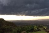 Dark storm clouds over the Sunshine Coast hinterland moving toward the coast