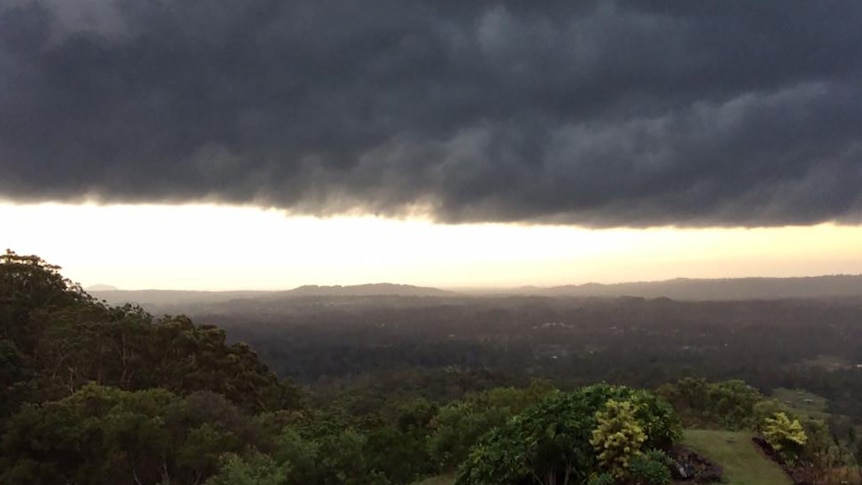 Dark storm clouds over the Sunshine Coast hinterland moving toward the coast