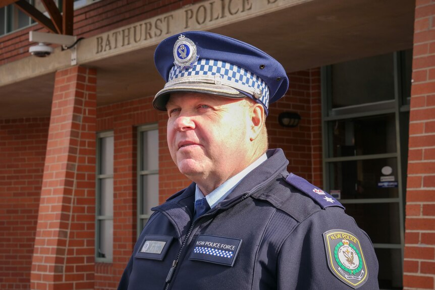 bathurst police superintendent bob noble in hat outside police station