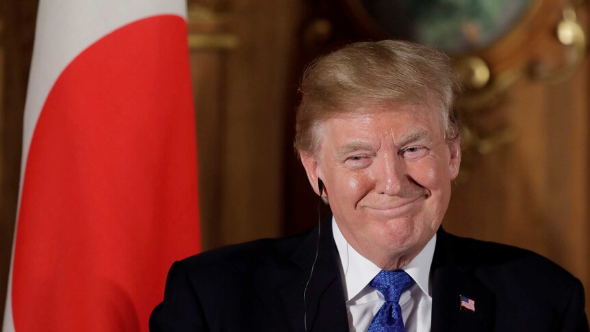 US President Donald Trump reacts during a news conference with Shinzo Abe, Japan's prime minister, not pictured, at Akasaka Palace in Tokyo, Japan, November 6, 2017.