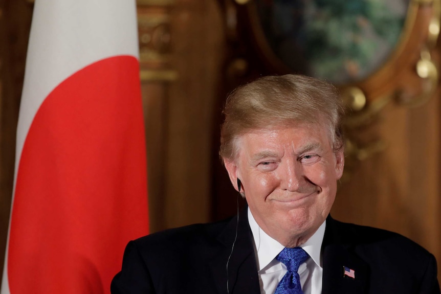 US President Donald Trump reacts during a news conference with Shinzo Abe, Japan's prime minister, not pictured, at Akasaka Palace in Tokyo, Japan, November 6, 2017.