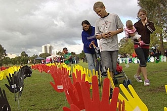 Plastic hands planted in Sydney on Sorry Day 26 May 2007 to mark the 10th anniversary of the Bringing Them Home report, which...