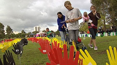 Plastic hands planted in Sydney on Sorry Day 26 May 2007 to mark the 10th anniversary of the Bringing Them Home report, which...