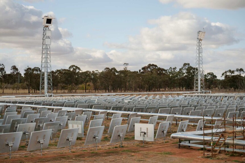 A solar farm with mirrors and towers