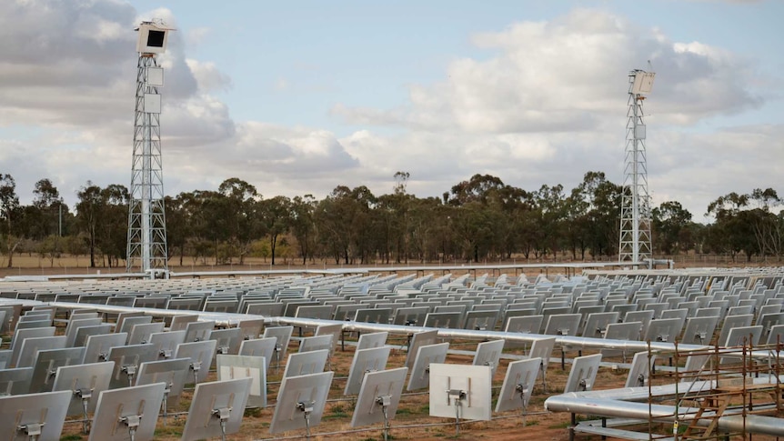 A solar farm with mirrors and towers