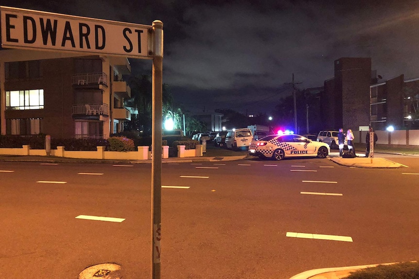 A police car blocking off a street at night time in Alexandra Headland