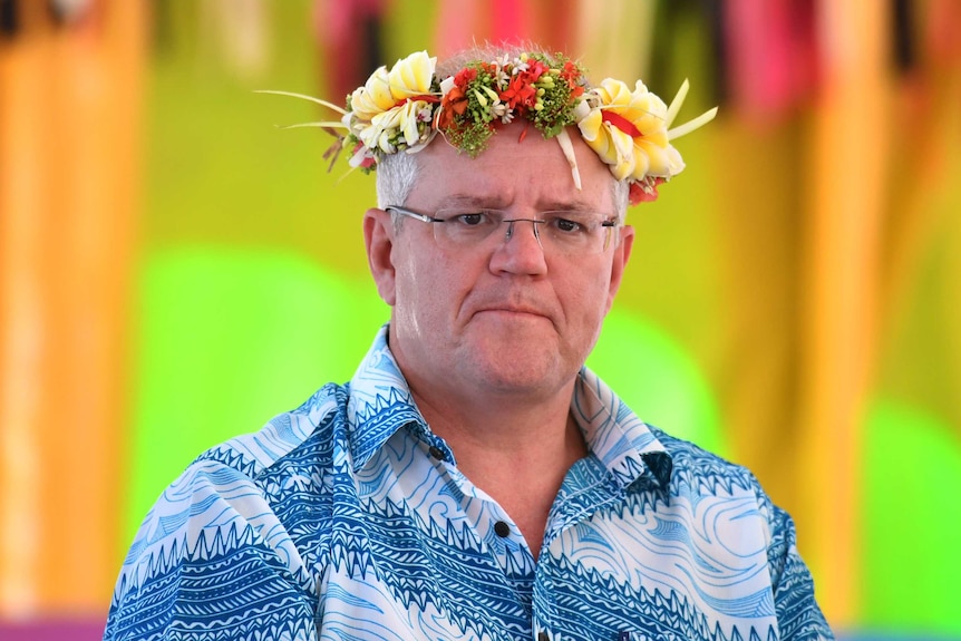 Scott Morrison wearing a tropical shirt and floral crown