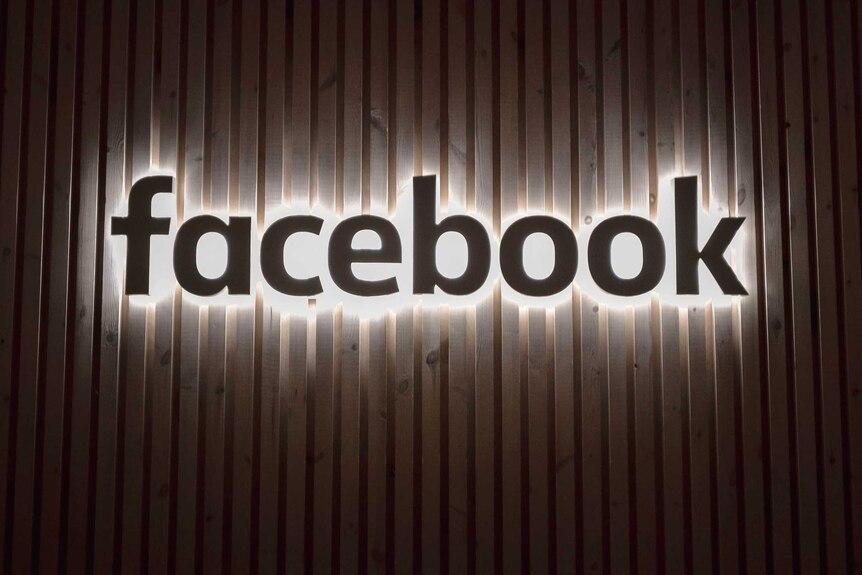 Facebook's company logo appears on a wall at its offices in New York.