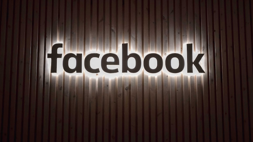 Facebook's company logo appears on a wall at its offices in New York.