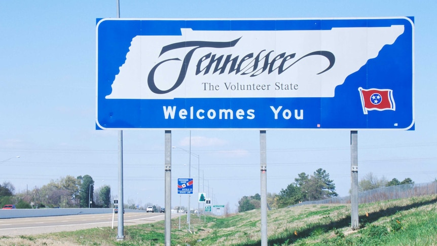 A road sign that reads 'Tennessee: the volunteer state'.