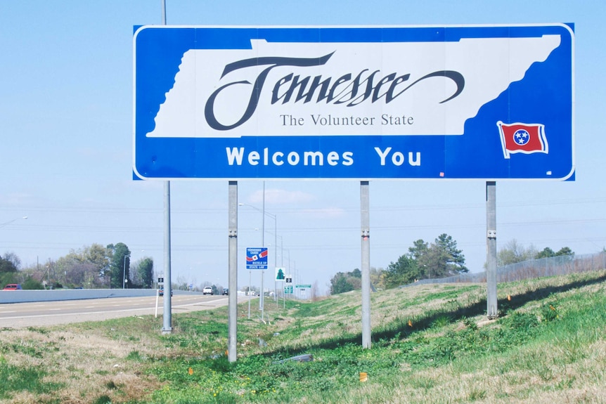 A road sign that reads 'Tennessee: the volunteer state'.