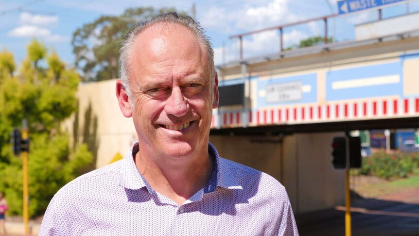 Profile of Paul Shanahan with Bayswater Train Station in the background