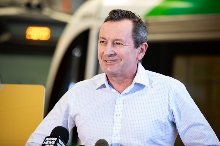 Mark McGowan smiling as he speaks to the media.