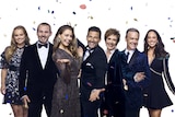 Neighbours stars are dressed in formal wear as confetti falls around them.