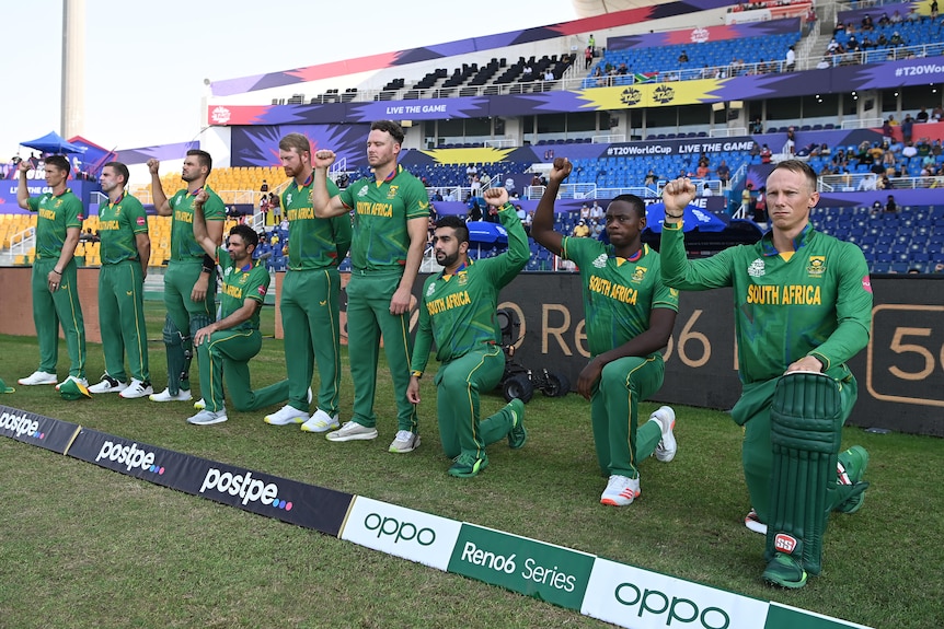 Some cricketers take a knee while others stand with their fists raised and others just stand