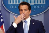 Former White House communications director Anthony Scaramucci blows a kiss at the end of a press briefing.