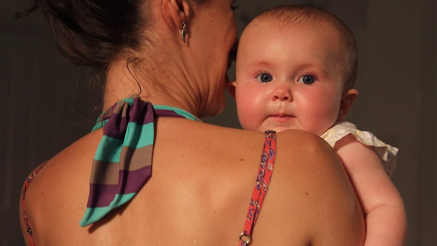 mother holding an infant