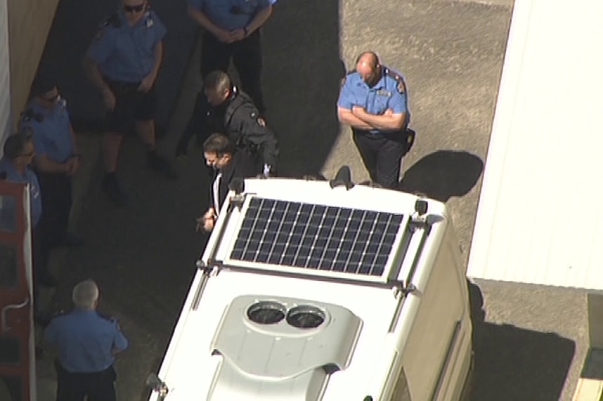A photo taken from above of Bradley Edwards leaving a prison van.