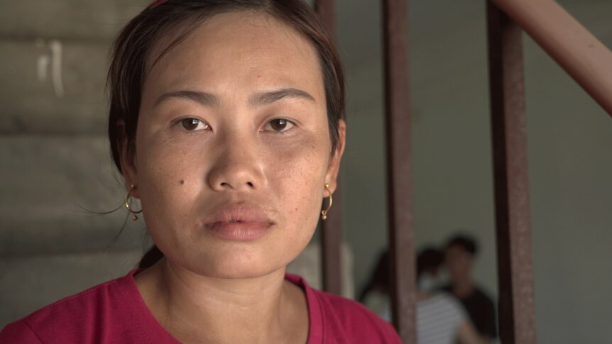 Close-up shot of woman who worked in a chicken farm