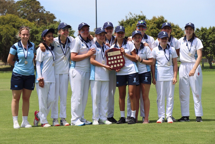 The under 14 girls with their trophy after winning the 2021 Victorian Metro rep tournament