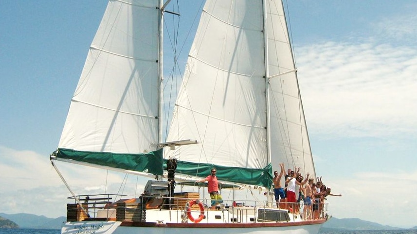 A group of people standing on the private charter boat "Waltzing Matilda"
