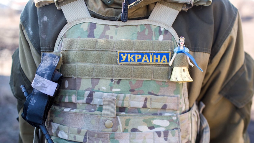 A Snow White charm on Ukrainian soldier's armour.