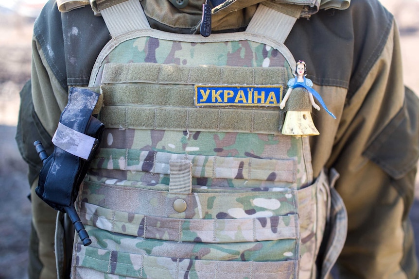 A Snow White charm on Ukrainian soldier's armour.