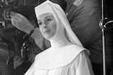 Debbie Reynolds dressed as a nun on the set of The Singing Nun