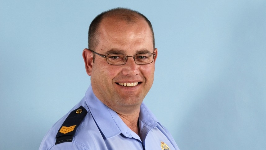 Tasmanian police officer Robert Cooke smiles at the camera.