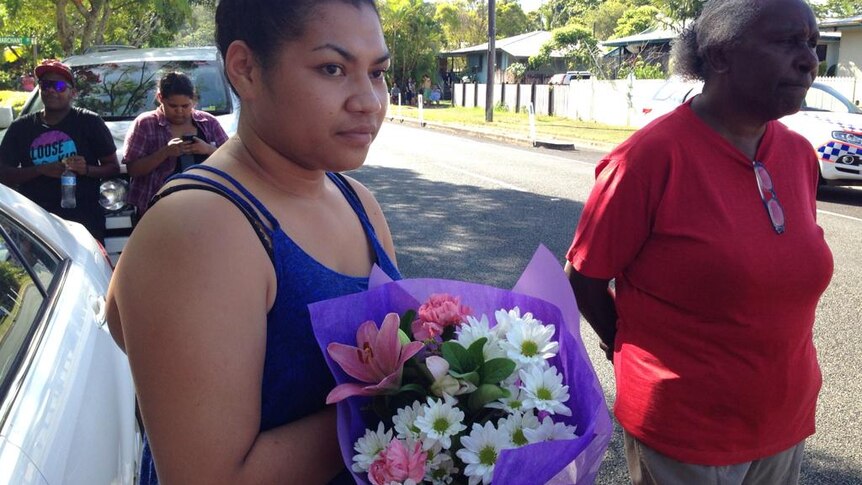 Ngatu Tenu attends the scene of a deadly stabbing in Cairns. Ms Tenu told the ABC she was a family friend of the victims.