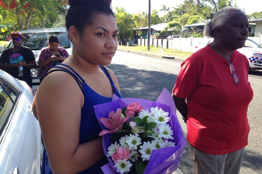 Ngatu Tenu attends the scene of a deadly stabbing in Cairns. Ms Tenu told the ABC she was a family friend of the victims.
