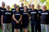 Members of the Fluoride-free party in Western Australia wear their party's shirt in a group photo.