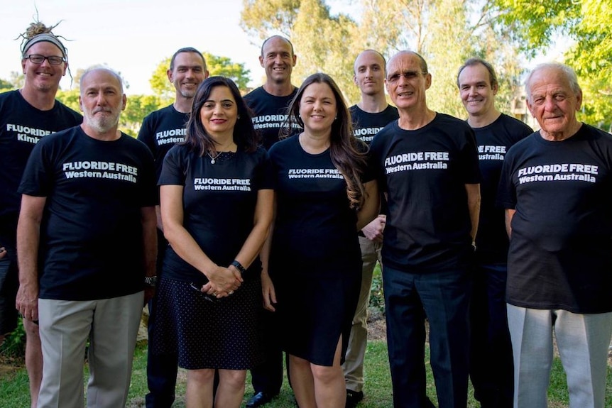 Members of the Fluoride-free party in Western Australia wear their party's shirt in a group photo.