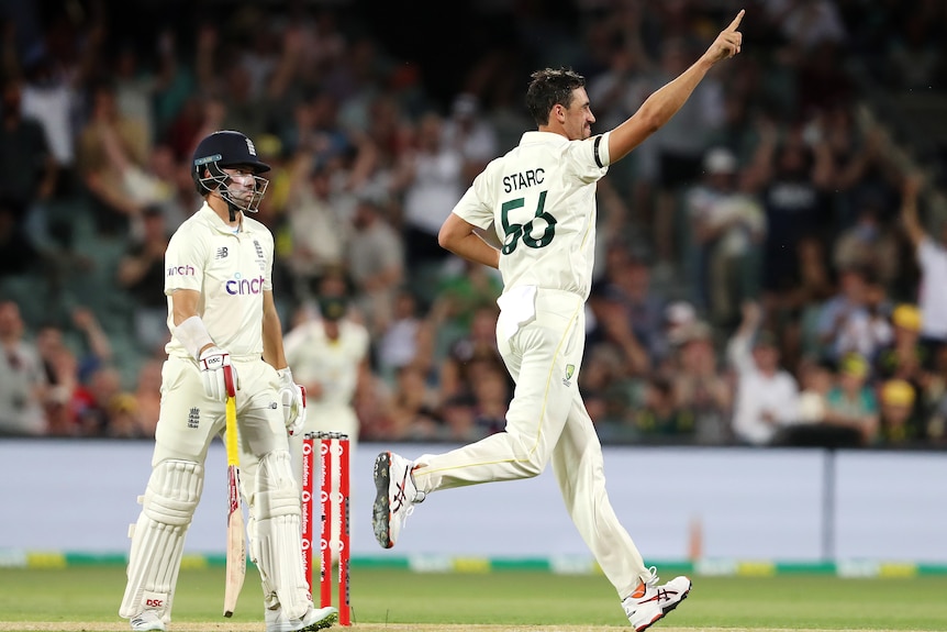 Mitchell Starc points to the crowd as Rory Burns looks disappointed