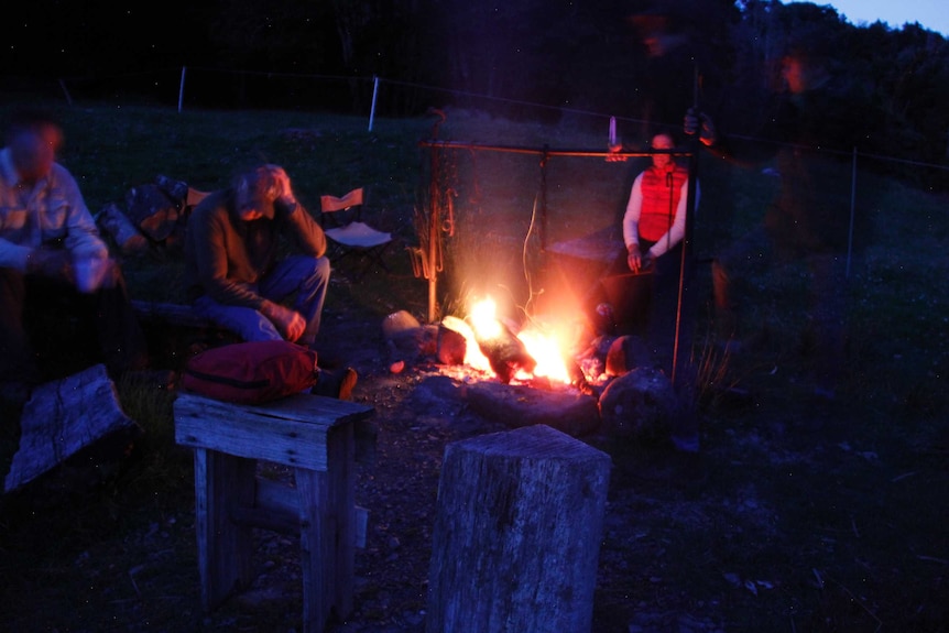 The family around the campfire at night