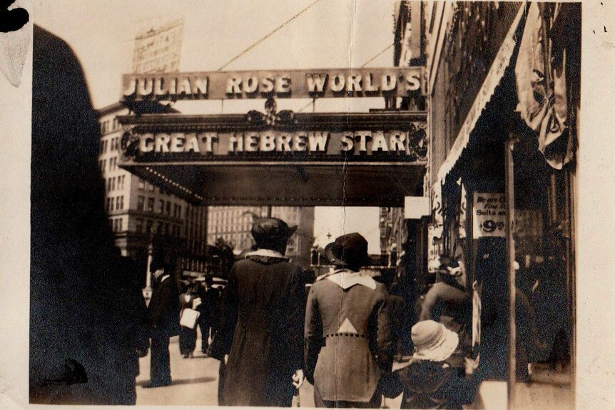People walk past a theatre. It's sign reads "Julian Rose World's Great Hebrew Star". Written on the picture is 'Frisco 1914'.