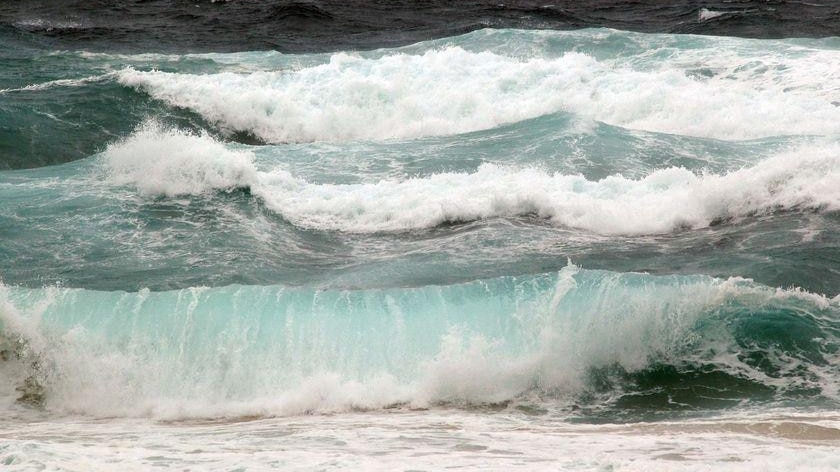 Rough surf pounds a beach